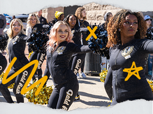VCU cheerleaders hold poms-poms in unison