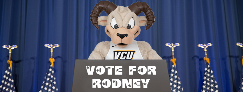 Rodney the Ram standing at a podium with a 